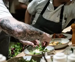 Chefs plating dishes